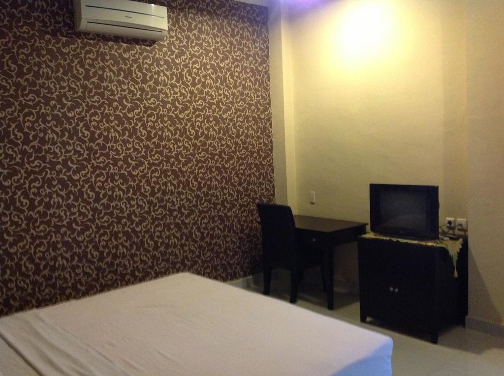 Hotel Carolina Transit à Medan Chambre photo